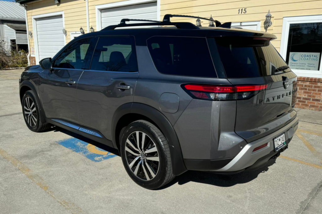 A 2020 Mitsubishi Outlander Limited AWD with tinted windows, showcasing its sleek design and modern features.